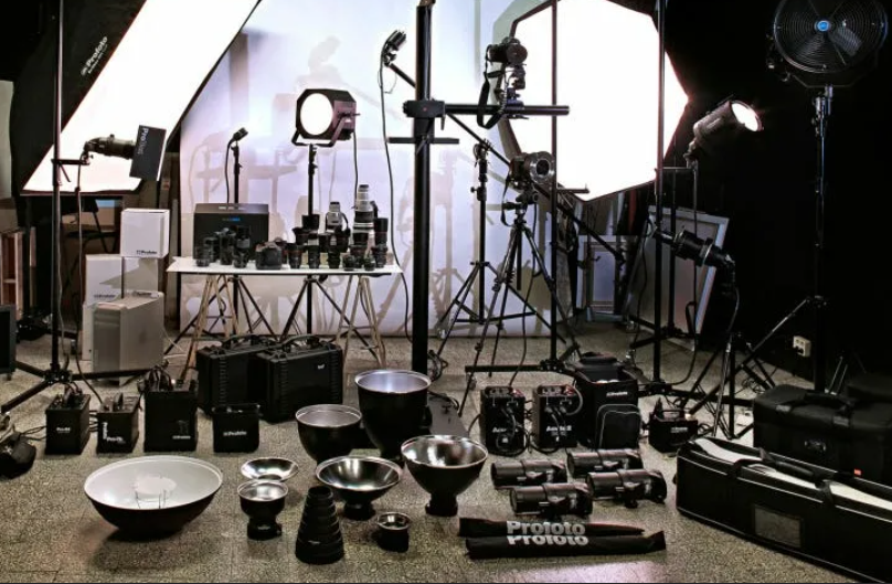 array of cameras, lenses, lights and audio recorders